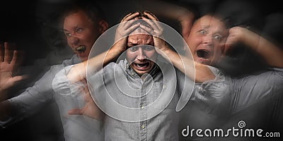 Man having panic attack on dark background Stock Photo