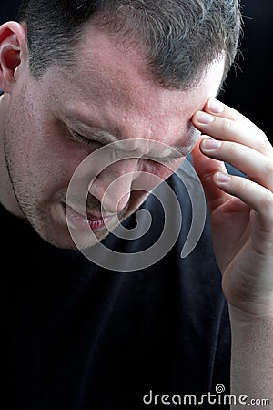 Man With Headache or Migraine Pain Stock Photo