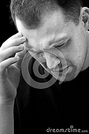 Man With Headache or Migraine Pain Stock Photo