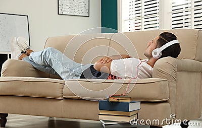 Man with headphones with book Stock Photo