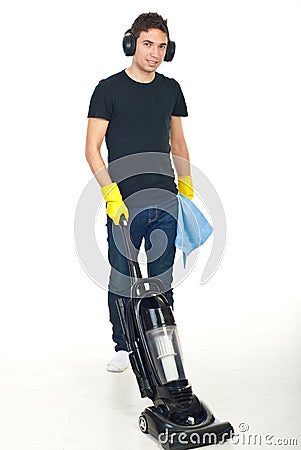 Man with headphones cleaning house Stock Photo
