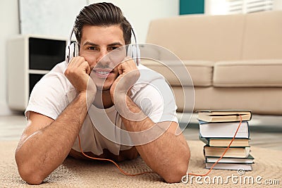 Man with headphones with book Stock Photo