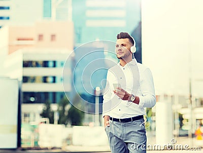 Man with headphones and smartphone listening music Stock Photo