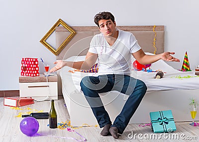 Man after heavy christmas partying at home Stock Photo