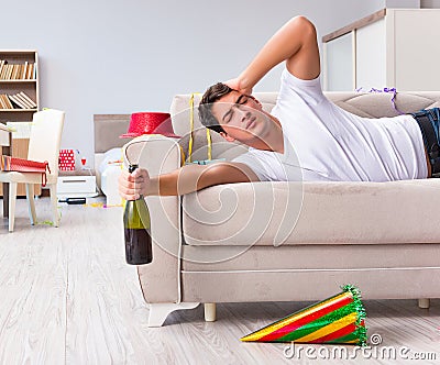 Man after heavy christmas partying at home Stock Photo