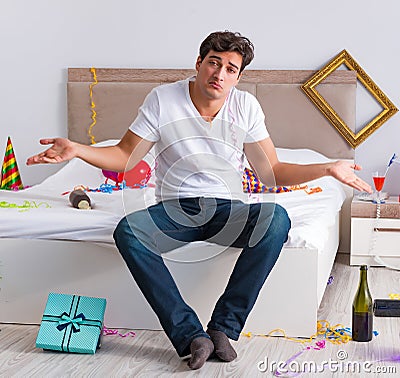 Man after heavy christmas partying at home Stock Photo