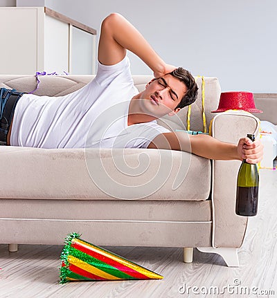 Man after heavy christmas partying at home Stock Photo