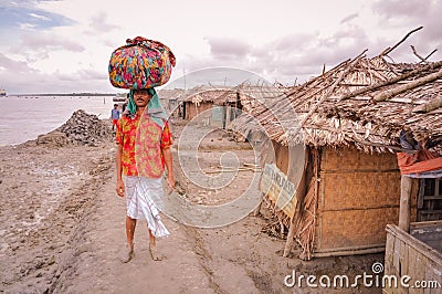 Man with heavy load in Bangladesh Editorial Stock Photo
