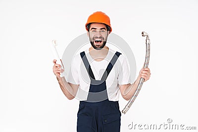 Man in helmet holding bathroom plumbing equipment Stock Photo
