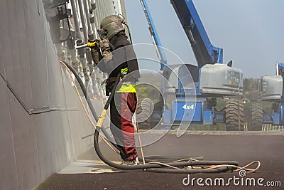 Man with helmet working on a bridge construction Editorial Stock Photo