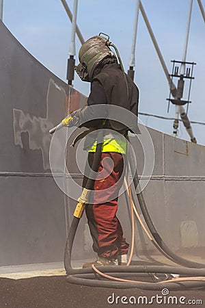 Man with helmet working on a bridge construction Editorial Stock Photo