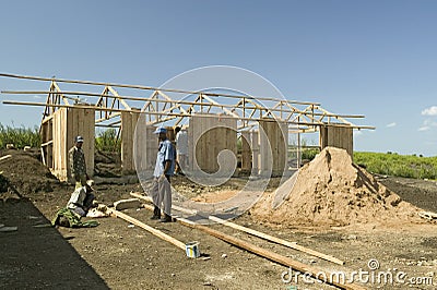 Man helps construct new houses for Pepo La Tumaini Jangwani, HIV/AIDS Community Rehabilitation Program, Orphanage & Clinic. Pepo Editorial Stock Photo