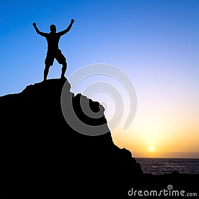 Man hiking success silhouette in mountains Stock Photo