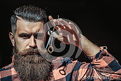 Man hipster with scissors. Barber scissors and straight razor, barber shop, suit. Vintage barber shop, shaving. Portrait Stock Photo