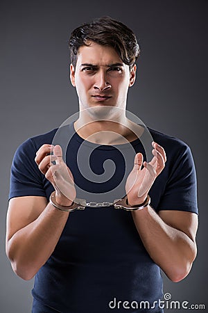 The man with his hands handcuffed in criminal concept Stock Photo