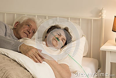 Man and his ill wife Stock Photo