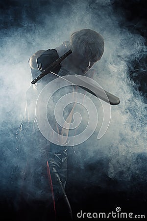 Man hit a sword in smoke Stock Photo