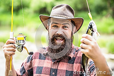 Man hold big fish trout in his hands. Fisherman and trophy trout. Man holding a trout fish. Fishing. Angler with fishing Stock Photo