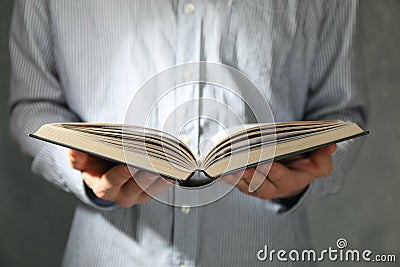 Man hold book in hands Stock Photo