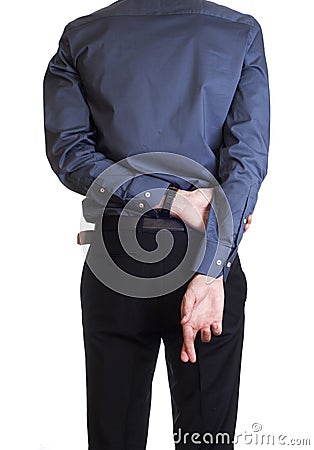 Man hold and hide on his back his cross fingers Stock Photo