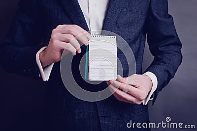 Man hold paper. Man`s style. dressing suit shirt and cuffs Stock Photo