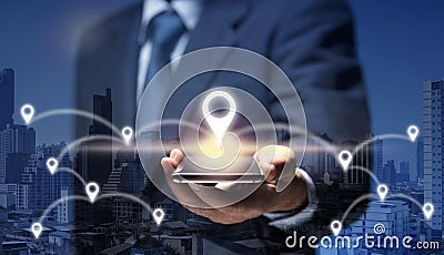 Man hold smart Phone connect to GPS location icon show global business, direction, travel, 5G concept. Businessman use internet Stock Photo