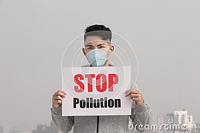 Man hold stop pollution sign Stock Photo