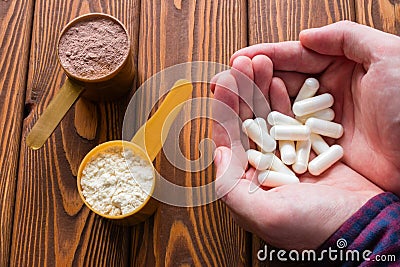 Man holding amino acid capsules Stock Photo