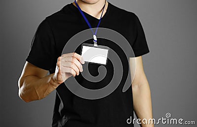 Man holding a badge. Close up. Isolated background Stock Photo