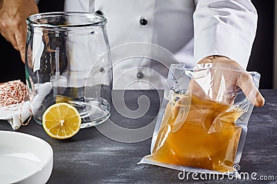 Man holding bag with SCOBY to make kombucha Stock Photo