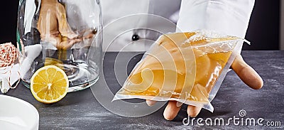 Man holding bag with SCOBY to make kombucha tea Stock Photo