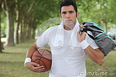 Man holding a basket ball Stock Photo