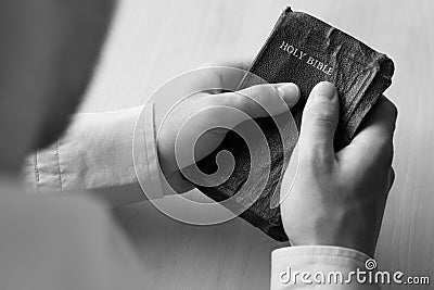 Man holding bible Stock Photo