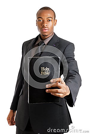 Man holding a bible showing commitment Stock Photo