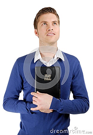 Man holding a bible showing commitment Stock Photo