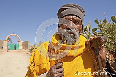 A man holding a carved cross, Ethiopia Editorial Stock Photo