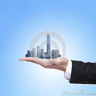 Man holding a city in hand Stock Photo