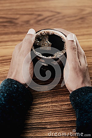 Man holding coffee on a table 4 Stock Photo