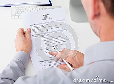 Man holding curriculum vitae Stock Photo