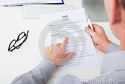 Man holding curriculum vitae Stock Photo