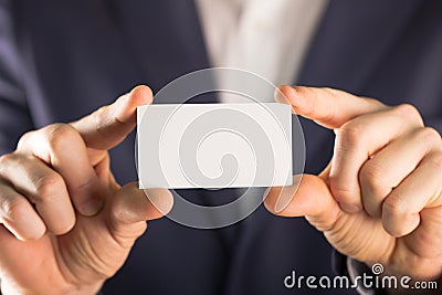 Man holding empty buissnes card Stock Photo