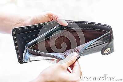 Man holding an empty wallet Stock Photo