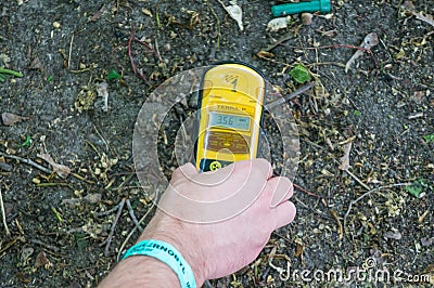 Man holding a Geiger counter in Chernobyl Editorial Stock Photo