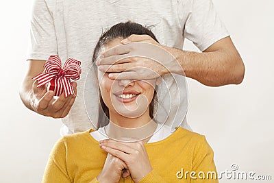 Man holding gift box and giving girlfriend Stock Photo