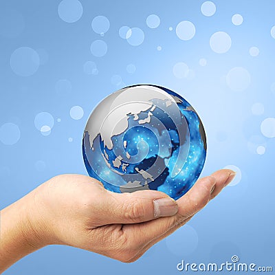 A man holding a globe on his hand Stock Photo