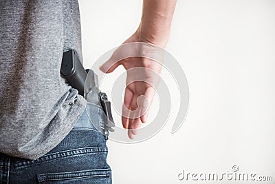 Man holding a gun in his hand Stock Photo