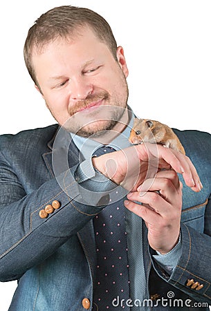 Man holding hamster on arm Stock Photo