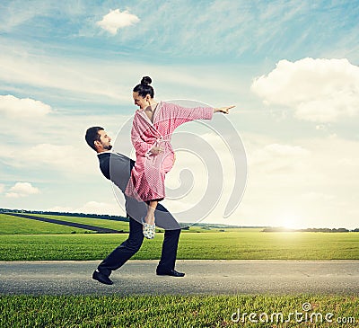 Man holding her angry wife Stock Photo