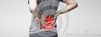 Man holding his hands behind his back, pain in spine Stock Photo