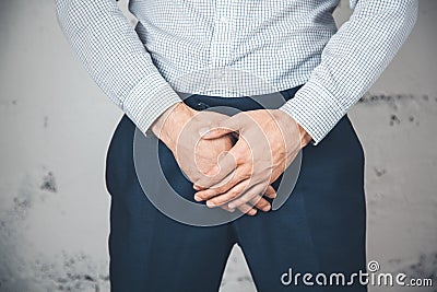 Man holding his urethra in pain Stock Photo